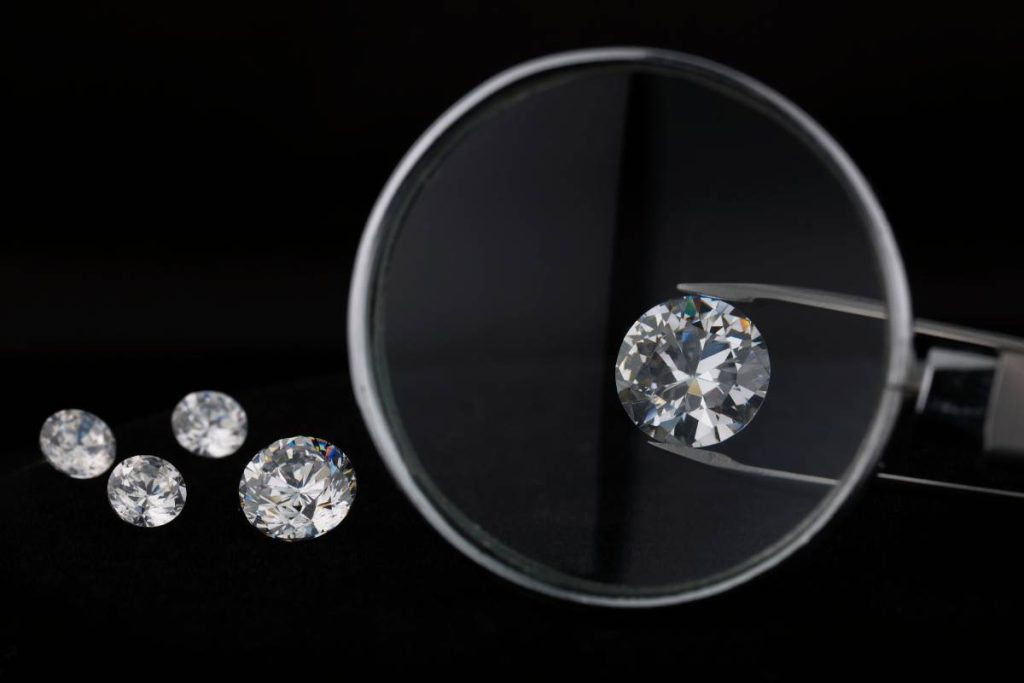 Magnifying glass over diamond