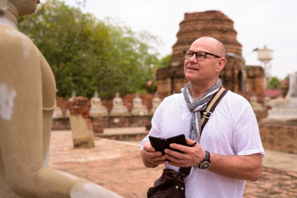 Portrait of senior Scandinavian tourist man spending vacation in Ayutthaya city of Thailand