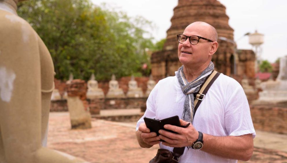 Portrait of senior Scandinavian tourist man spending vacation in Ayutthaya city of Thailand