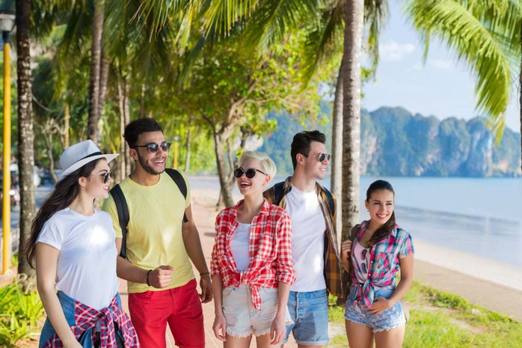 Young People Group Tropical Beach Palm Trees Friends Walking Speaking Holiday Sea Summer Vacation Ocean Travel