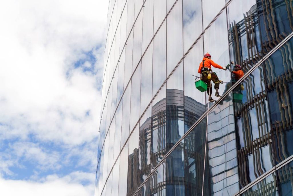 worker-in-safety-gear-clean-the-windows-of-a-tall-2024-09-06-06-07-19-utc (1)