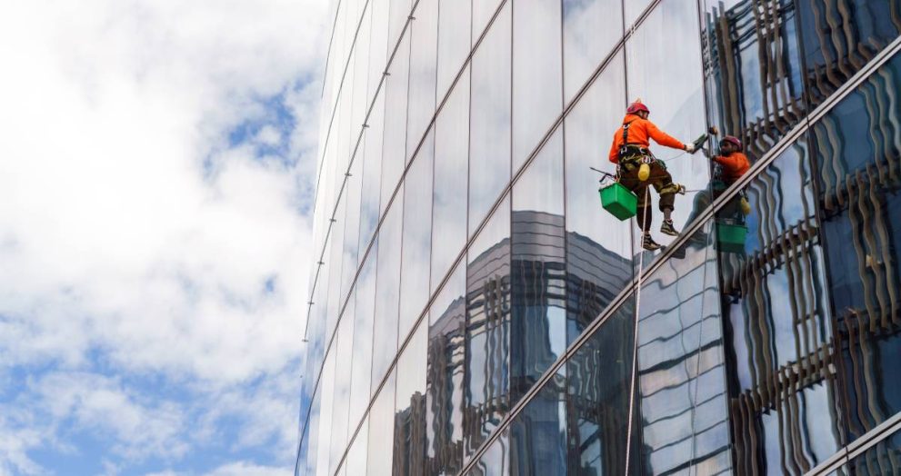 worker-in-safety-gear-clean-the-windows-of-a-tall-2024-09-06-06-07-19-utc (1)