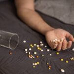 Addiction Causes suicide-attempt-male-hand-with-pills-2025-01-09-02-07-13-utc (1)