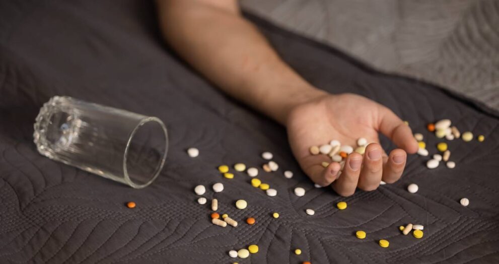 Addiction Causes suicide-attempt-male-hand-with-pills-2025-01-09-02-07-13-utc (1)