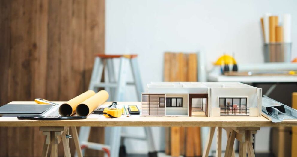 Profession concept with architect desk and tools on a wooden table. Architect concept.