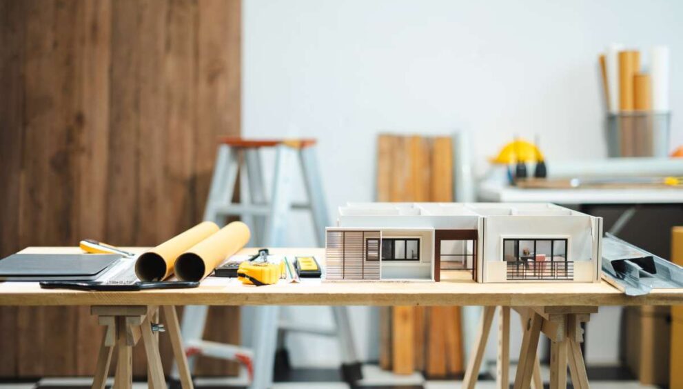 Profession concept with architect desk and tools on a wooden table. Architect concept.